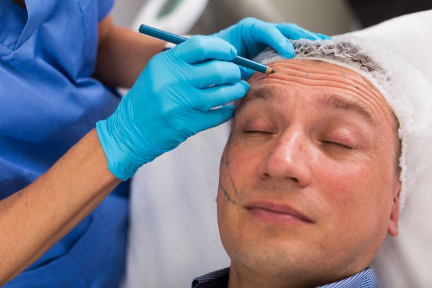 istock Female doctor is preparing patient for procedure with using marker 1325382647