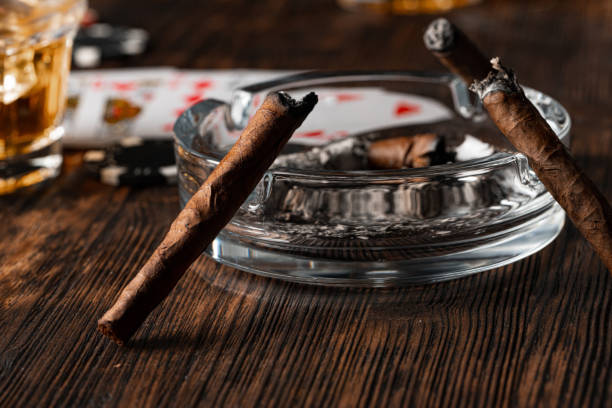 istock Cigar and playing cards on casino table 1325383331