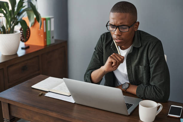 istock Shot of a young businessman planning while working from home 1325384417