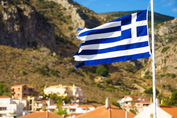 istock Greek flag against town 1325385834