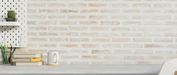 istock Mock-up workspace with stationery, copy space, decorations and brick wall background, 3D render 1325386260