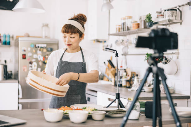istock Japanese woman filming a food tutorial 1325387585