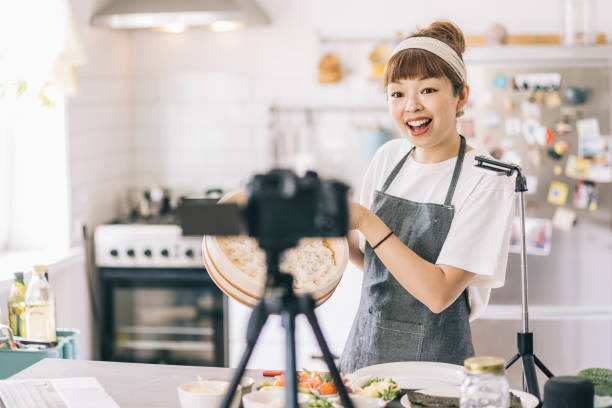 Japanese woman filming a food tutorial