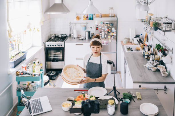istock Japanese woman filming a food tutorial 1325387596
