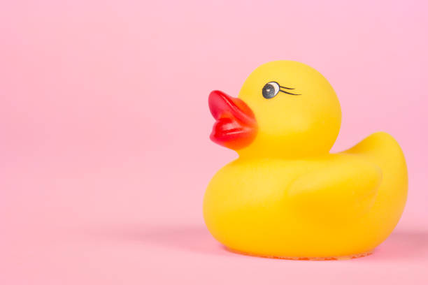 istock Rubber duck on the pink background. 1325388353