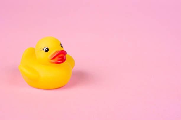istock Rubber duck on the pink background. 1325388372