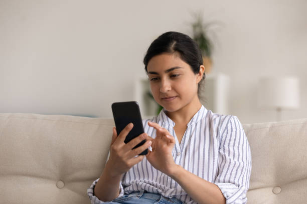 istock Indian woman use cellphone speak on video call 1325391009