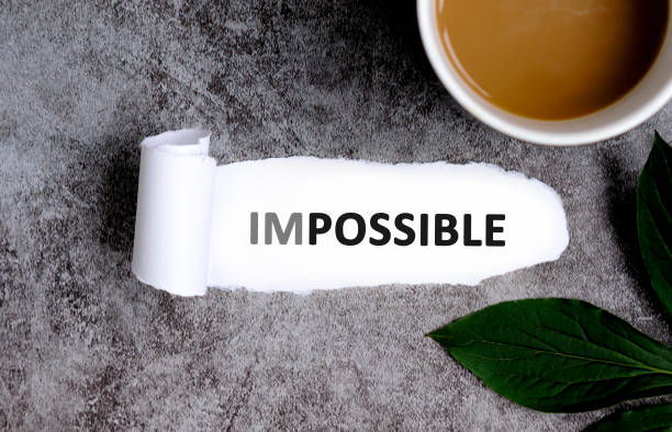 istock Impossible with cup of coffee and green leaf 1325397740