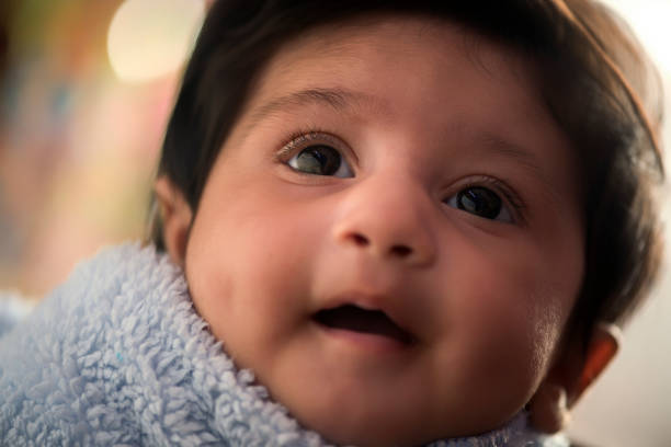 istock New Born Smiling Baby Girl 1325405571
