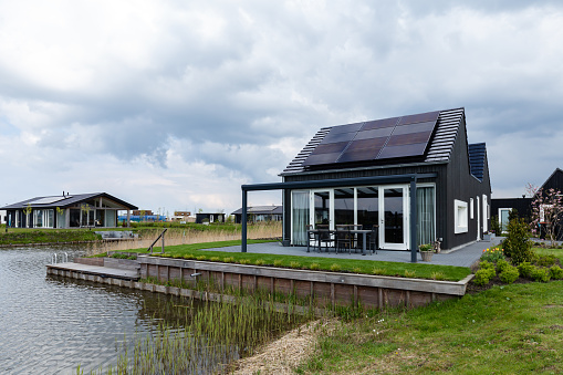 Blauwestad, The Netherlands - May 1, 2021: Modern sustainable wooden houses in the newly developed city Blauwestad in Oldambt Groningen in The Netherlands