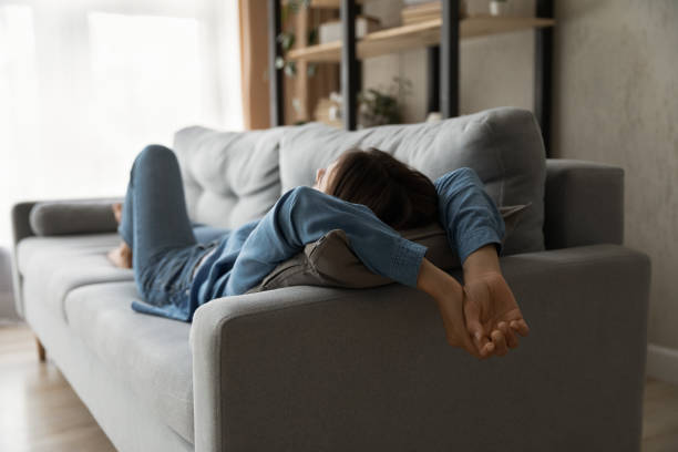 istock Relaxed millennial woman lying on comfortable sofa. 1325412527