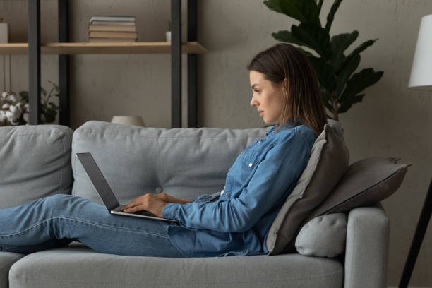 istock Happy young freelance woman working on computer at home. 1325412537