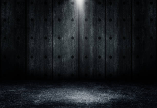 istock Studio dark room concrete floor grunge texture background with spot lighting effect. 1325413832