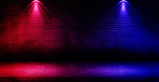 istock Studio dark room with fog or mist and lighting effect red and blue on concrete floor grunge texture background. 1325413890