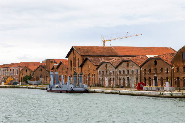 istock Industrial shipyards (Arsenale di Venezia) in Italy, Venice. Loading cranes and docks. 1325415872
