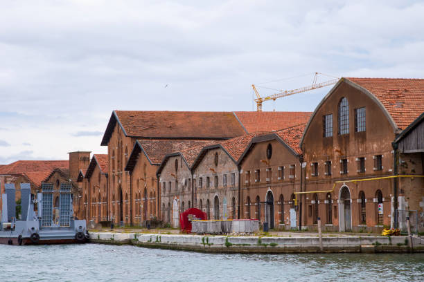 istock Industrial shipyards (Arsenale di Venezia) in Italy, Venice. Loading cranes and docks. 1325416418