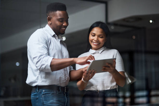 istock Shot of Two businesspeople working in a modern office 1325416701