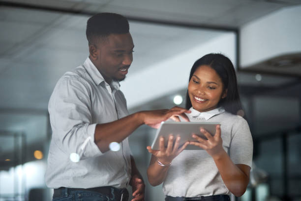 istock Shot of Two businesspeople working in a modern office 1325416703