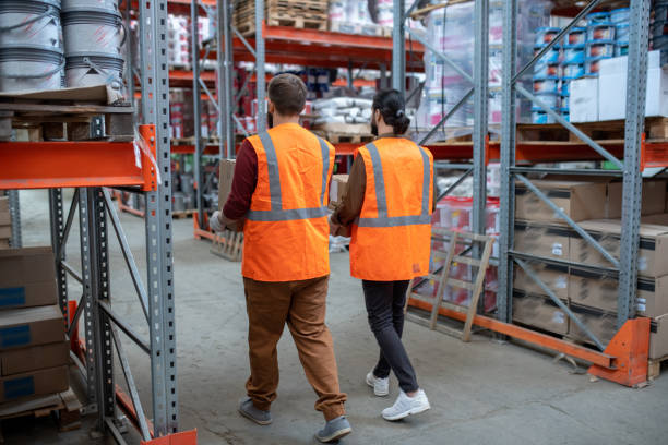 istock Two male workers of storehouse loading goods 1325417085