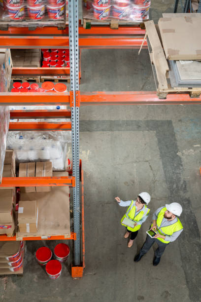 istock Two warehouse workers discussing quality of delivered goods 1325417114