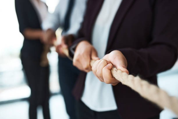 istock Cropped shot of unrecognizable businesspeople pulling on a rope 1325418337