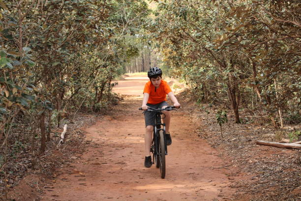 istock boy riding a bike 1325419560