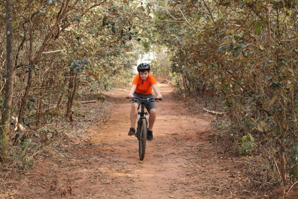 istock boy riding a bike 1325419657