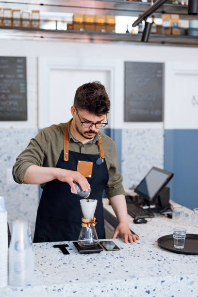 istock Profesional Barista Preparing Drip Coffee in a Cafe 1325419803