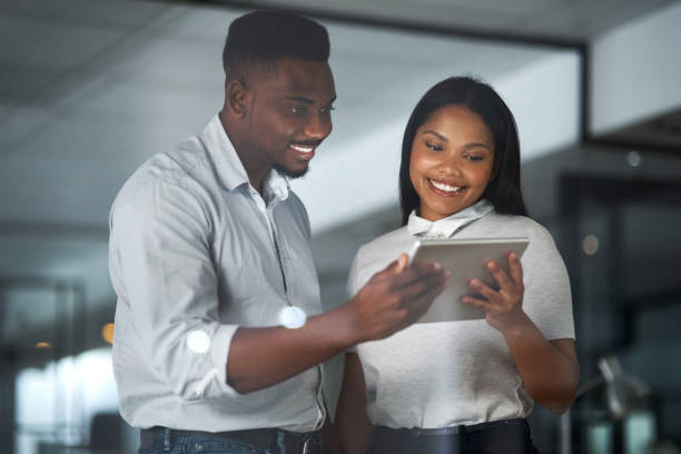 istock Shot of Two businesspeople working in a modern office 1325420433