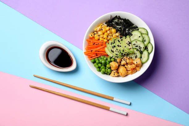istock Delicious salad with chicken and vegetables on color background, flat lay 1325420606