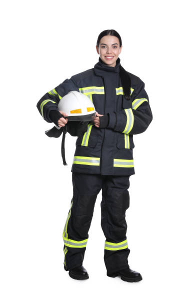 full length portrait of firefighter in uniform with helmet on white background - bombeiro imagens e fotografias de stock