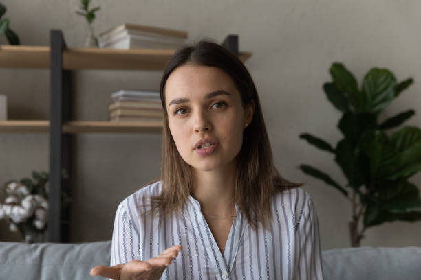istock Beautiful young woman holding video call conversation. 1325420942