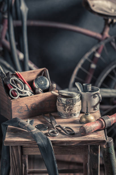 Small bicycle repair workshop with spare parts. Vulcanization workshop In an old wooden shed.