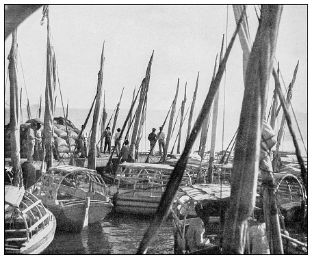 Antique black and white photograph of people from islands in the Caribbean and in the Pacific Ocean; Cuba, Hawaii, Philippines and others: Falucas in Havana Harbor, Cuba