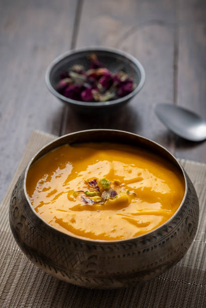 istock Mango Pulp / Aam rus or Ras served in small bowls 1325423600
