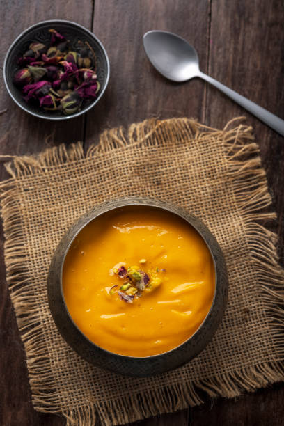 istock Mango Pulp / Aam rus or Ras served in small bowls 1325423649