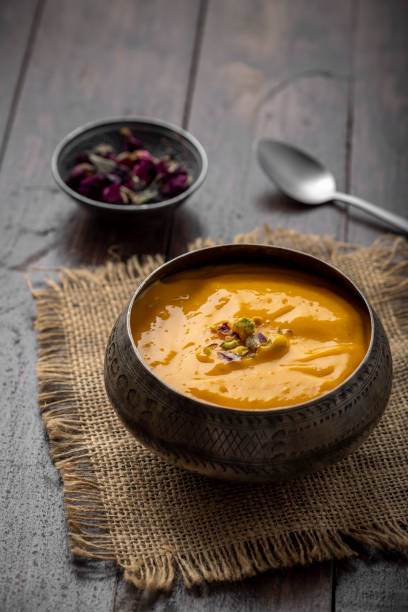 istock Mango Pulp / Aam rus or Ras served in small bowls 1325423747