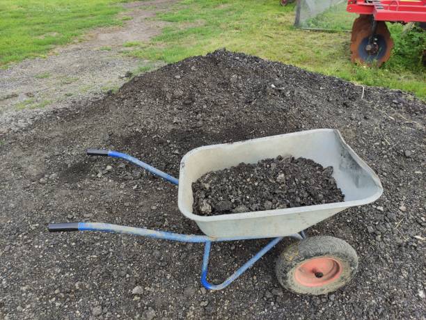 istock Wheelbarrow with stones, a coal or fertilizer and manure 1325423921