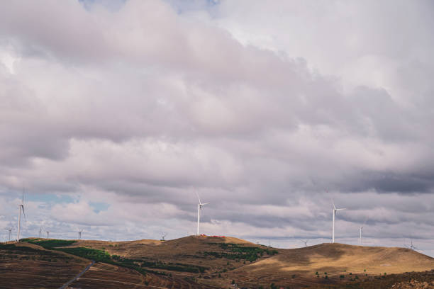 istock Wind Turbines In The Grassland Under Cloudy Sky 1325423949