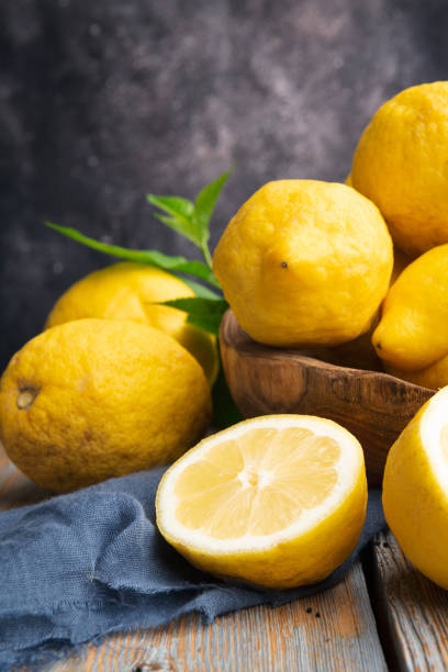 istock Fresh lemons on an old vintage wooden table 1325425294