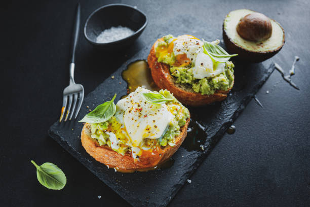 istock Tasty fresh toast with avocado and egg 1325428151