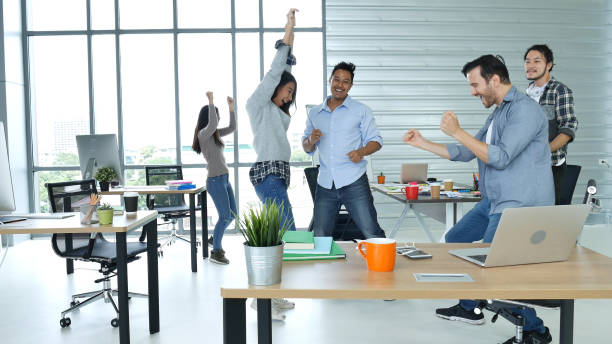 istock Office teamwork celebration working happiness Happy business people dance expression together at office after job done complete in meeting room. Diversity people happy moment dance together in company 1325428475