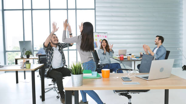 istock Office teamwork celebration working happiness Happy business people dance expression together at office after job done complete in meeting room. Diversity people happy moment dance together in company 1325428481