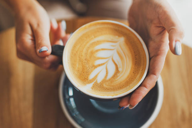 istock Cappuccino in cup of table 1325429411