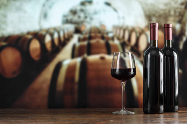 istock Wine cellar with a bottle of wine and glasses. Winemaking concept. 1325431145