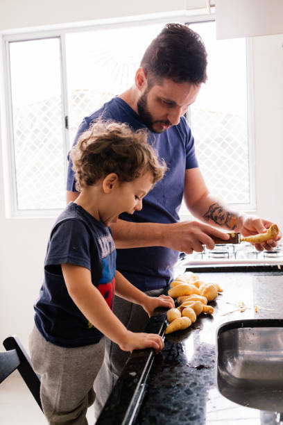 istock Father and son cooking 1325431562