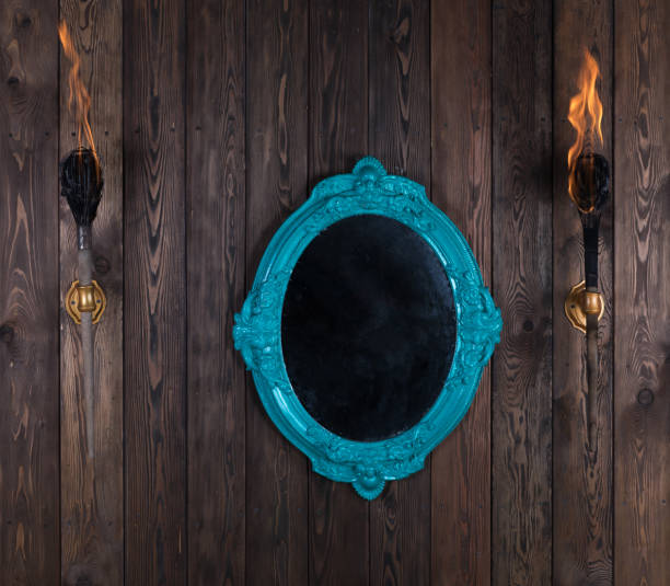 istock vintage victorian mirror on wooden wall 1325432091