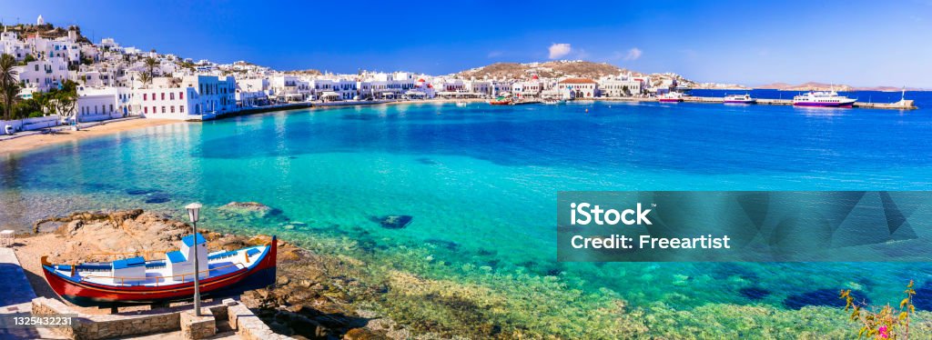 Mykonos island. Greece summer holidays. Panorama of old port in downtown with turquoise sea and beach. Cyclades. Mykonos Stock Photo