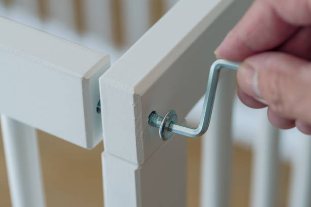 istock person assembling furniture using a hex wrench 1325433459