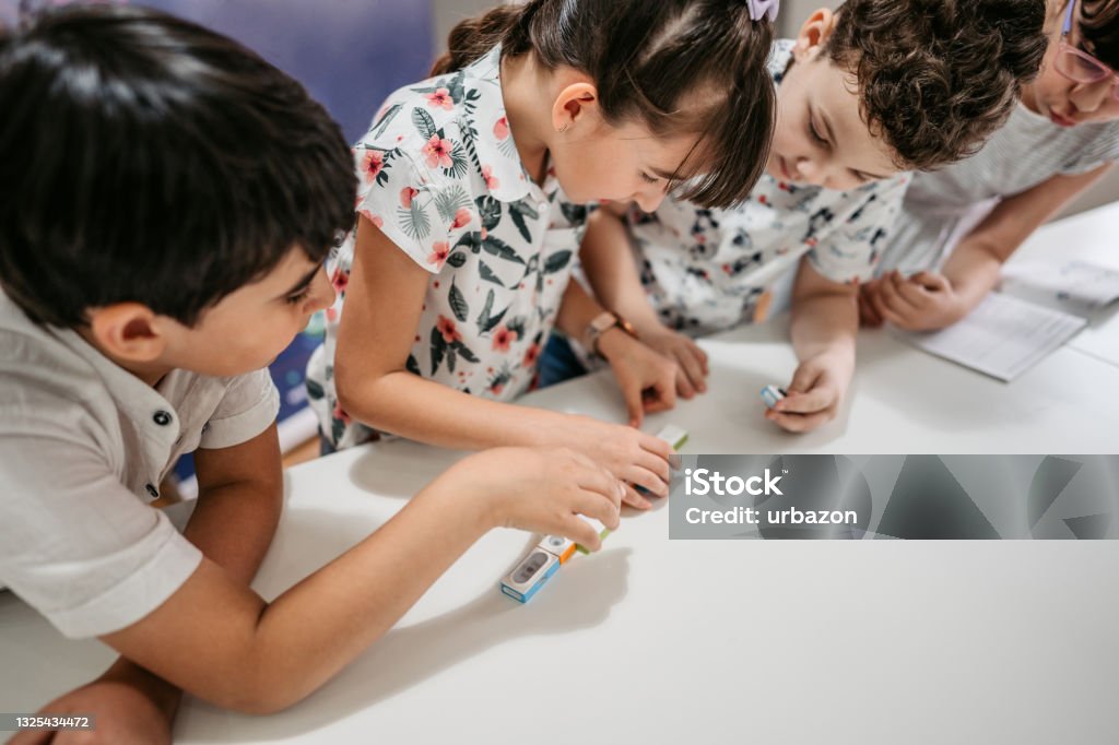 Elementary School Children Learning Programing Basics With Coding ...